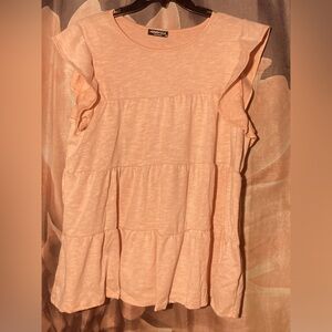 Ruffled short sleeve light peach colored top